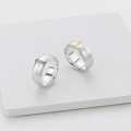 Linear Ring with a wide silver band and raised gold detail