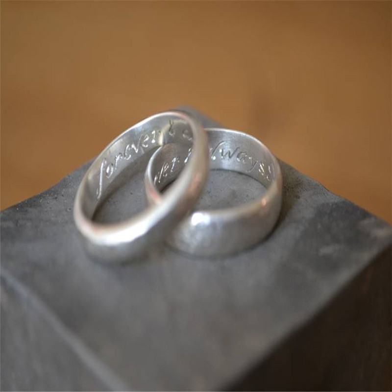 Handmade silver wedding ring with hammered finish