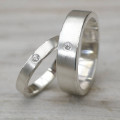 His and hers silver wedding rings