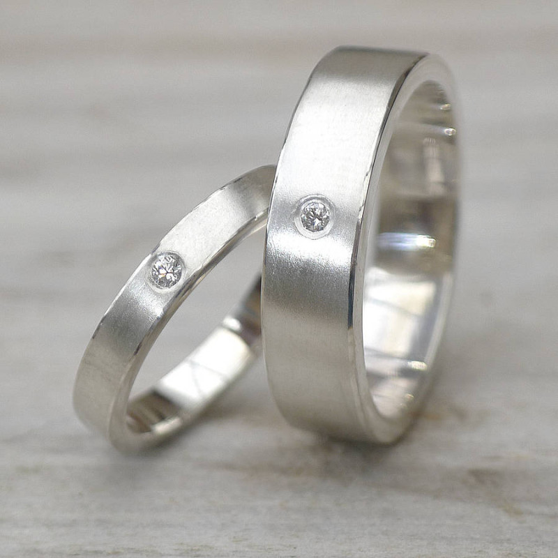 His and hers silver wedding rings