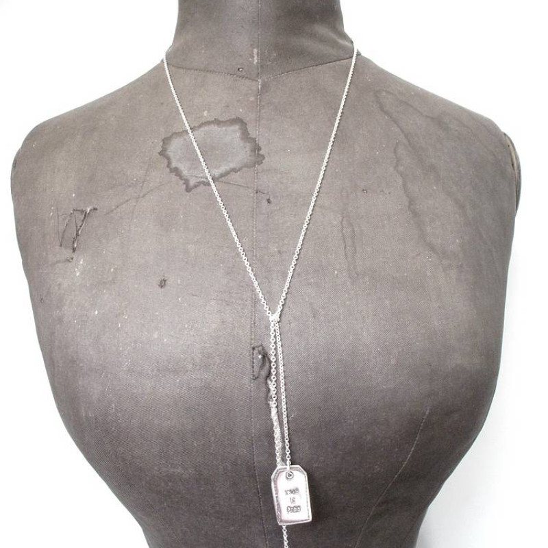 Fine Silver Label Lariat Necklace Fine silver label lariat necklace with crystal detail