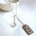 Fine Silver Lariat Label Tag Fine silver label tag on lariat necklace