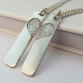 Pair of Inked Fingerprint Heart Pendant Necklaces Pair of inked fingerprint heart pendant necklaces