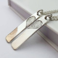 Pair of Inked Fingerprint Heart Pendant Necklaces Pair of inked fingerprint heart pendant necklaces