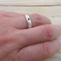Men's black diamond ring detail view