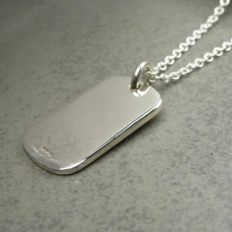 Silver Medical ID Tag Detail Silver medical ID tag pendant shown for personalised engraving
