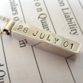 Personalised silver bar pendant with hand-punched lettering