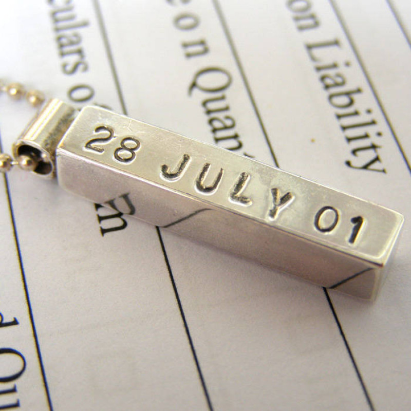 Personalised silver bar pendant with hand-punched lettering