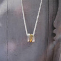 Silver Oval Necklace with Gold Silver oval necklace with three gold-plated oval rings