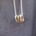 Silver Oval Necklace with Gold Silver oval necklace with three gold-plated oval rings