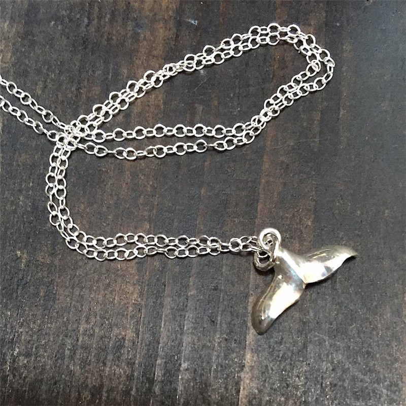 Silver whale tail pendant necklace