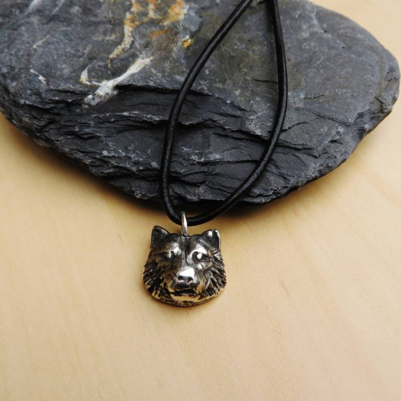 Silver wolf head necklace detail