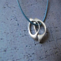 U & Me2 infinity pendants on leather necklace