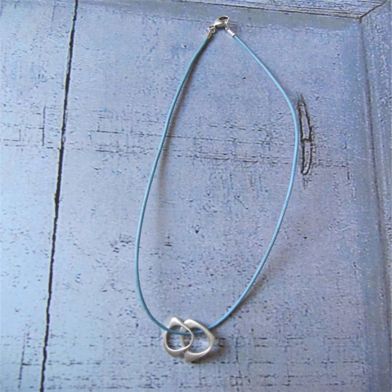 U & Me2 infinity pendants on leather necklace product image