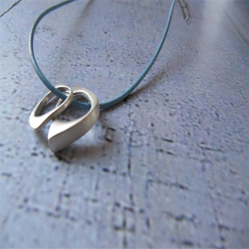 U & Me2 infinity pendants on leather necklace product image