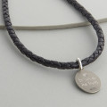 Woven leather and St Christopher necklet detail